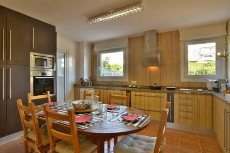 Kitchen And Dining Area In Three Bedroom Apartment With A Terrace In Palmanova