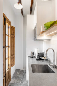 Kitchen Area In Renovated Three Bedroom Apartment Near Ramblas