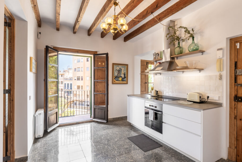 Kitchen Area In Renovated Three Bedroom Apartment Near Ramblas