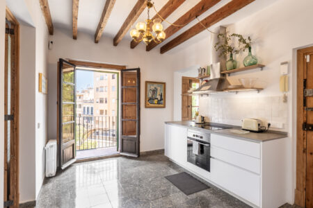 Kitchen Area In Renovated Three Bedroom Apartment Near Ramblas